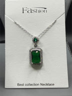 Emerald style crystal pendant necklace with silver chain from Republic Mercantile, featuring a sparkling green gemstone pendant.