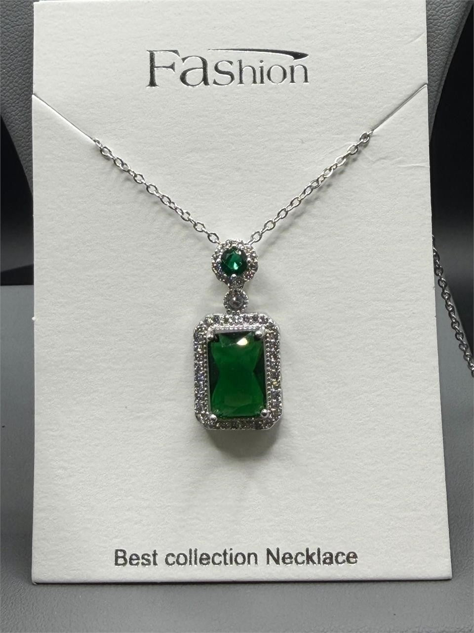 Emerald style crystal pendant necklace with silver chain from Republic Mercantile, featuring a sparkling green gemstone pendant.