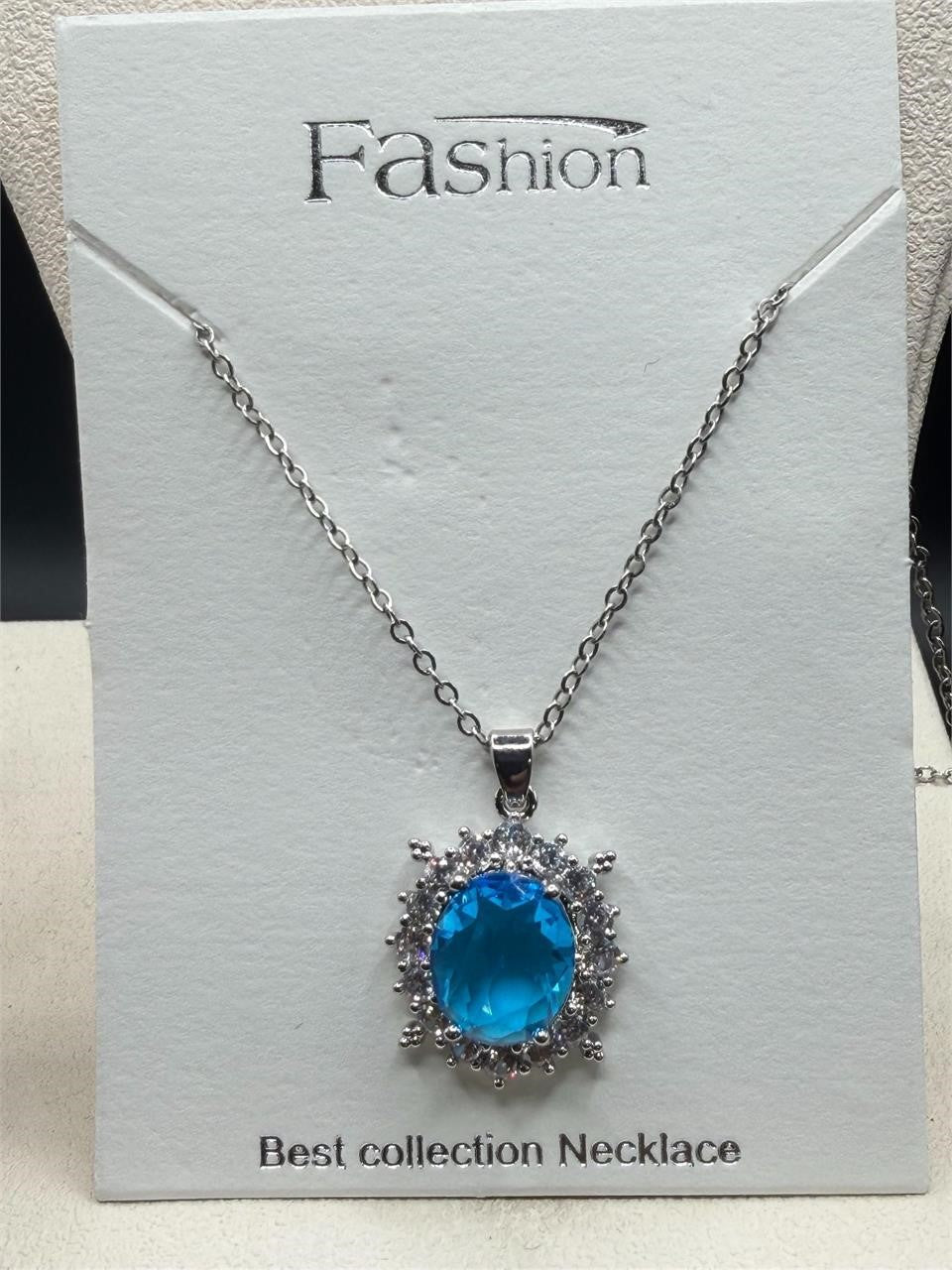 Elegant 2ct aquamarine style crystal pendant necklace with silver chain from Republic Mercantile, featuring a sparkling blue gemstone design.