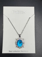 Elegant 2-carat aquamarine style crystal pendant necklace featuring a sparkling blue gemstone on a silver chain.