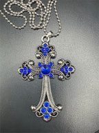 Large blue on silver crucifix pendant necklace featuring a detailed crucifix with a blue accent on a silver chain.
