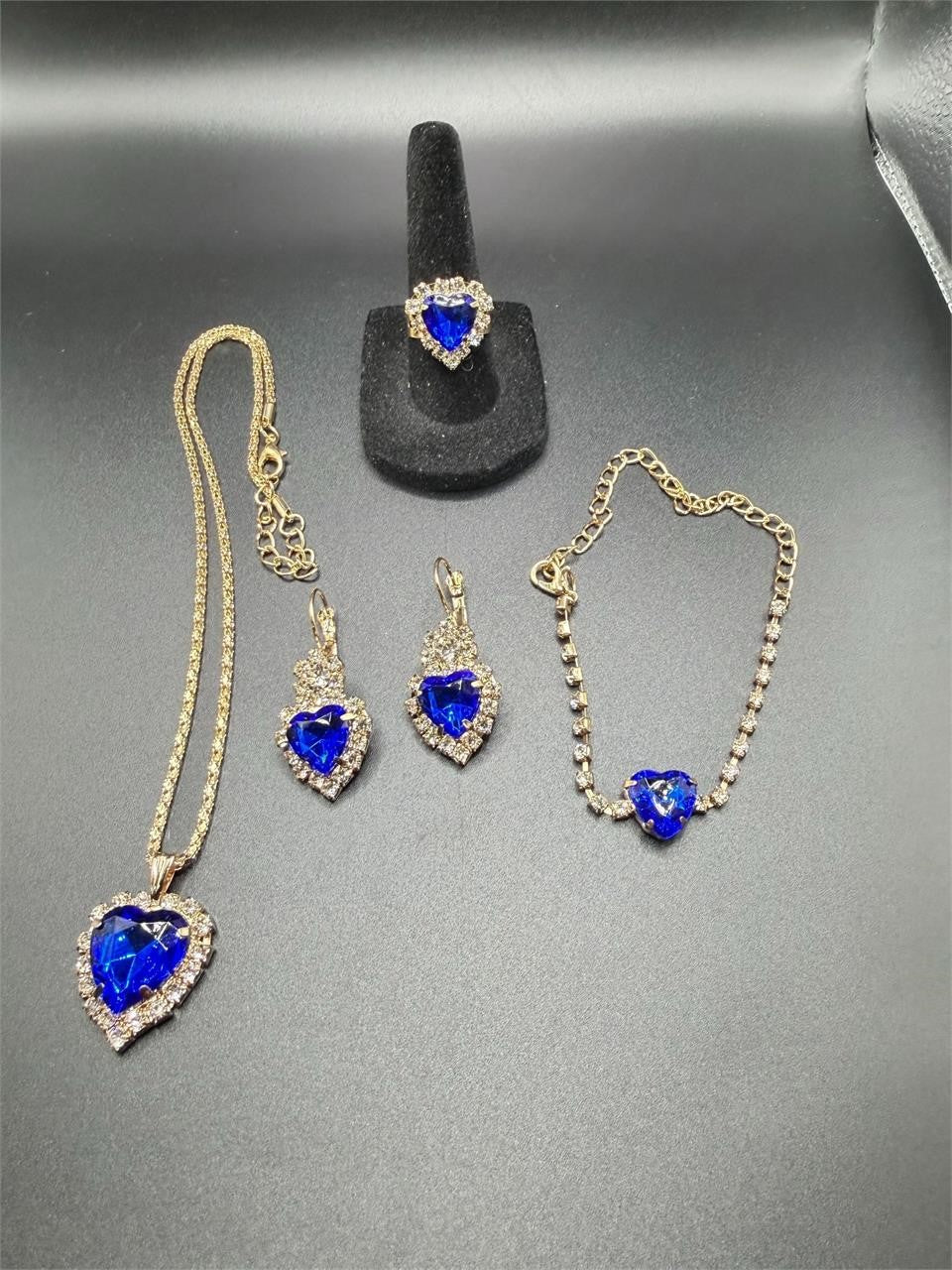 Five-piece fashion jewelry set featuring sapphire heart pendant and cubic zirconia earrings and necklace by Republic Mercantile.