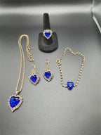 Five-piece fashion jewelry set featuring sapphire heart pendant and cubic zirconia earrings and necklace by Republic Mercantile.