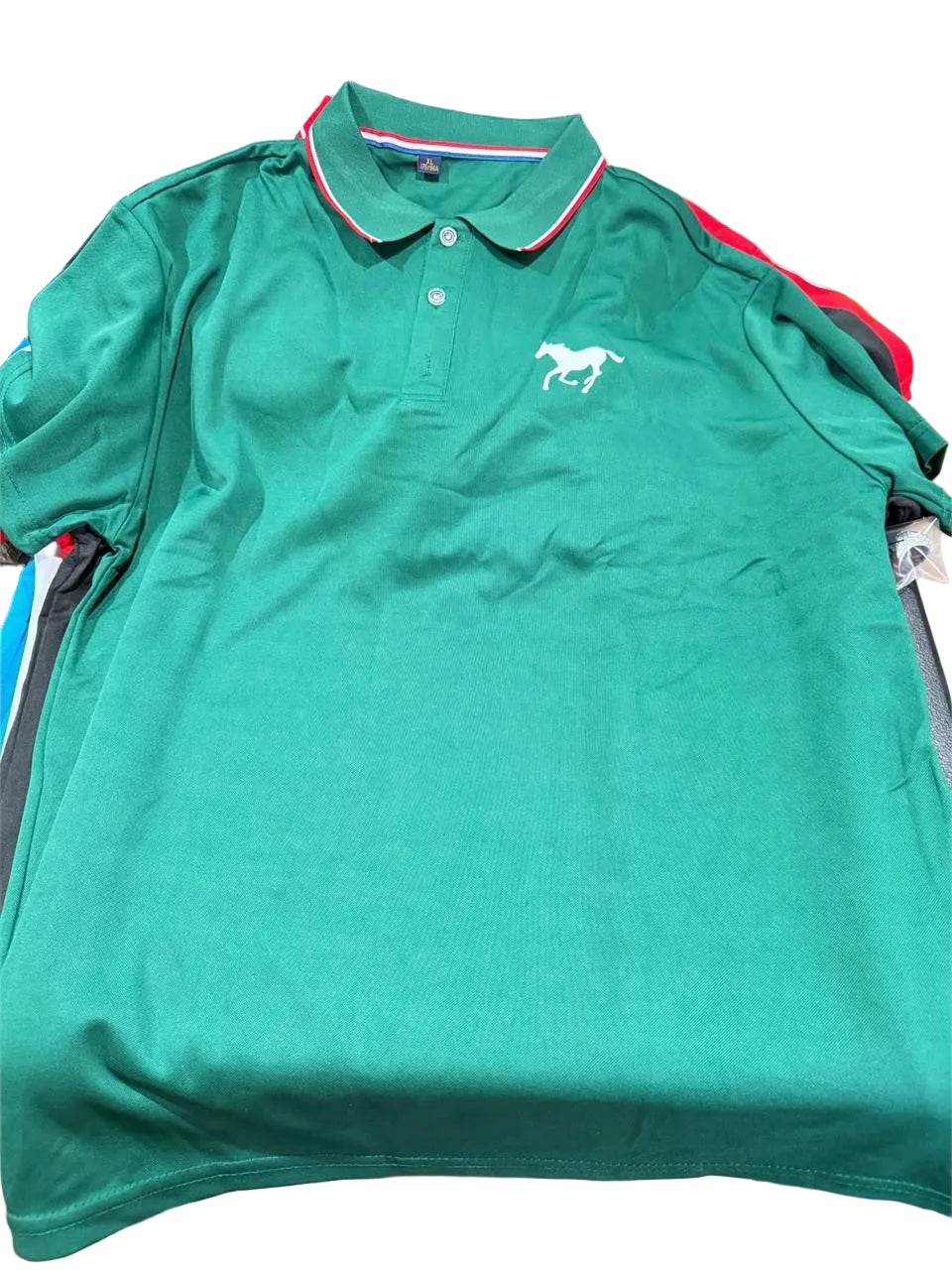 Men's green polo shirt by Republic Mercantile in size XL, featuring a classic collar and short sleeves, laid flat.