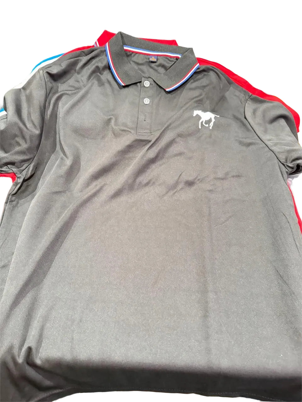 Men's black polo shirt in size XL from Republic Mercantile, showing the front view with collar and short sleeves.
