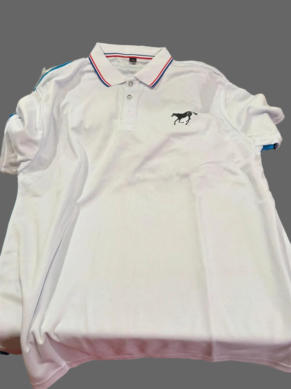 Men's white polo shirt in size XL from Republic Mercantile, featuring a classic collar and short sleeves.