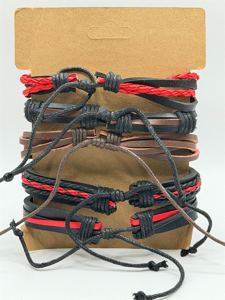 Red handcrafted 5 strand boho leather bracelet by Republic Mercantile featuring braided design and adjustable closure.