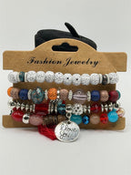 Handcrafted 4 strand boho beaded charm bracelet with colorful beads and metal charms by Republic Mercantile.