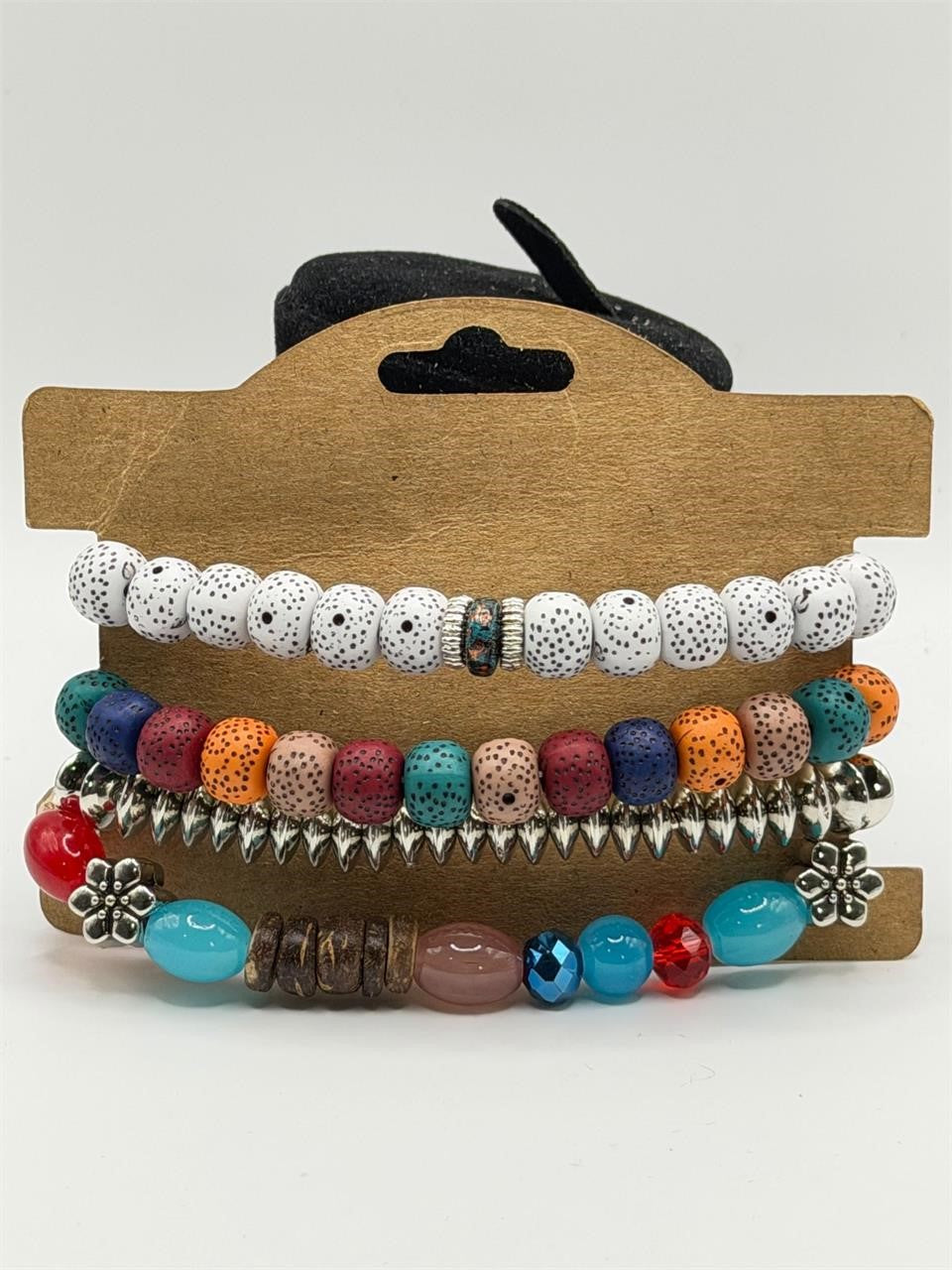 Handcrafted 4 strand boho beaded charm bracelet with colorful beads and metal charms by Republic Mercantile.