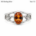 Sterling silver oval citrine ring with golden orange gemstone, size 7.5, by Republic Mercantile, featuring detailed band design.