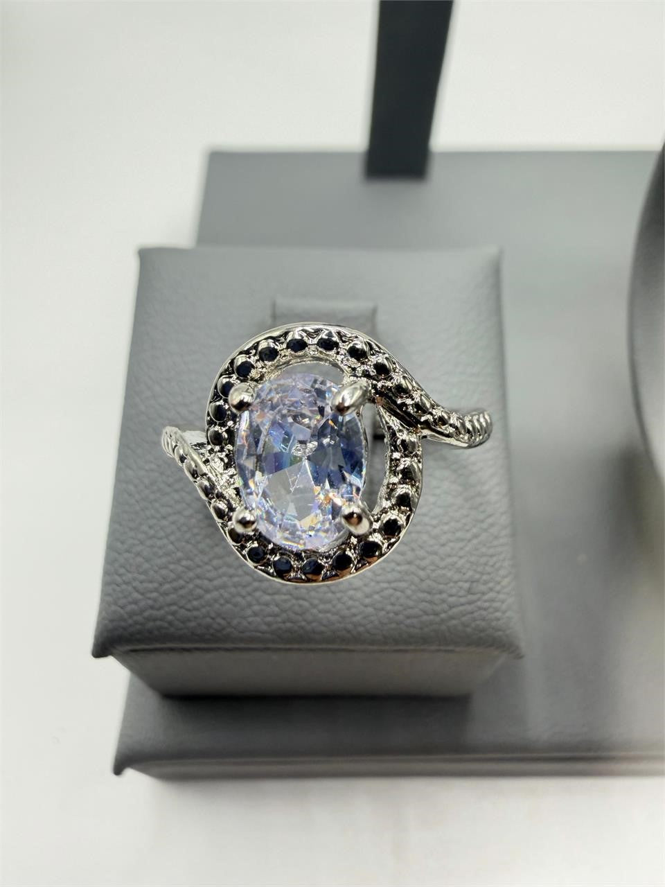 Sterling silver ladies mystic topaz ring size 6.75 featuring a vibrant, faceted gemstone and intricate band design.