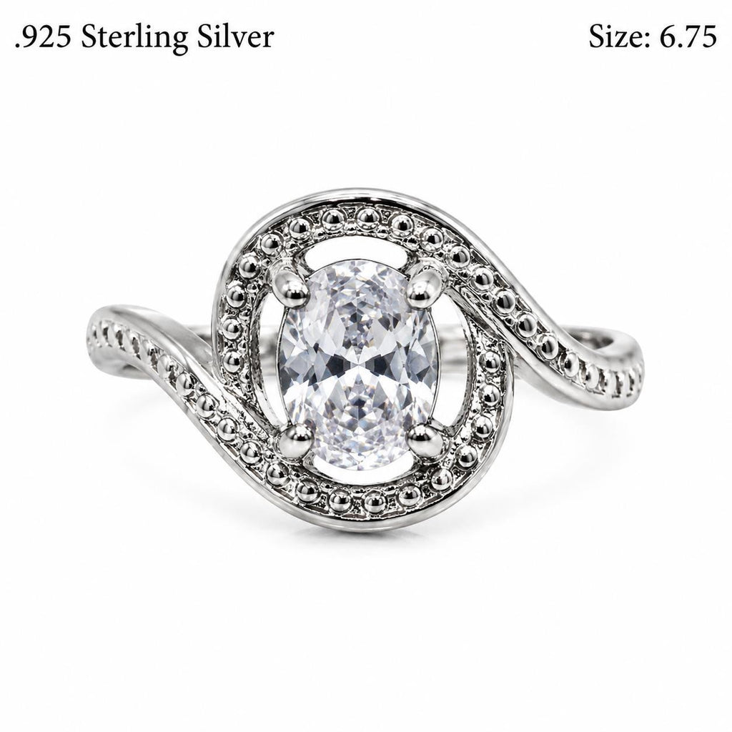 Lady's .925 sterling silver ring with a mystic topaz gemstone in size 6.75, showcasing intricate silver design.