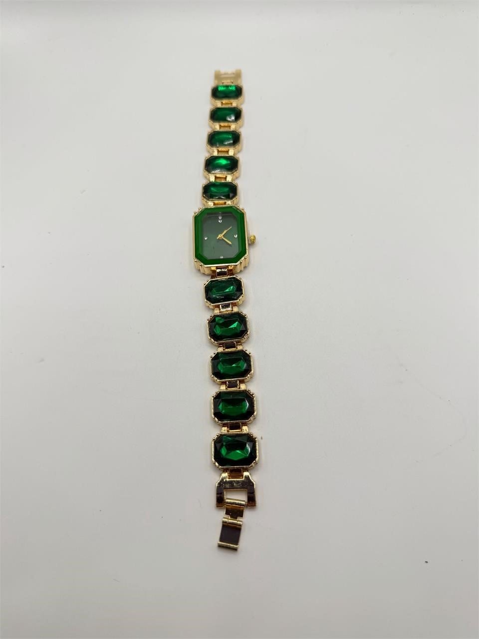 Ladies emerald green crystal stone band watch with silver case and elegant design, showcasing a stylish timepiece by Republic Mercantile.