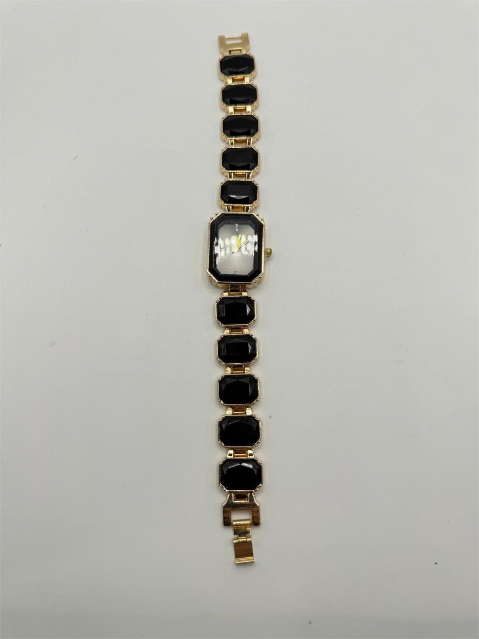 Ladies Onyx black crystal stone band watch with a sleek round face and silver accents, stylish and elegant for women.