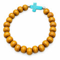 Beaded beige bracelet with blue cross charm, Republic Mercantile jewelry accessory featuring intricate beadwork and cross detail.