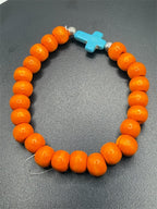 Beaded orange bracelet with blue cross charm from Republic Mercantile, featuring colorful bead details and religious cross pendant.