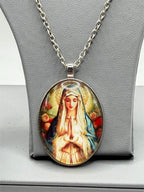 Virgin Mary enameled pendant necklace featuring a detailed religious icon on a silver chain, from Republic Mercantile.