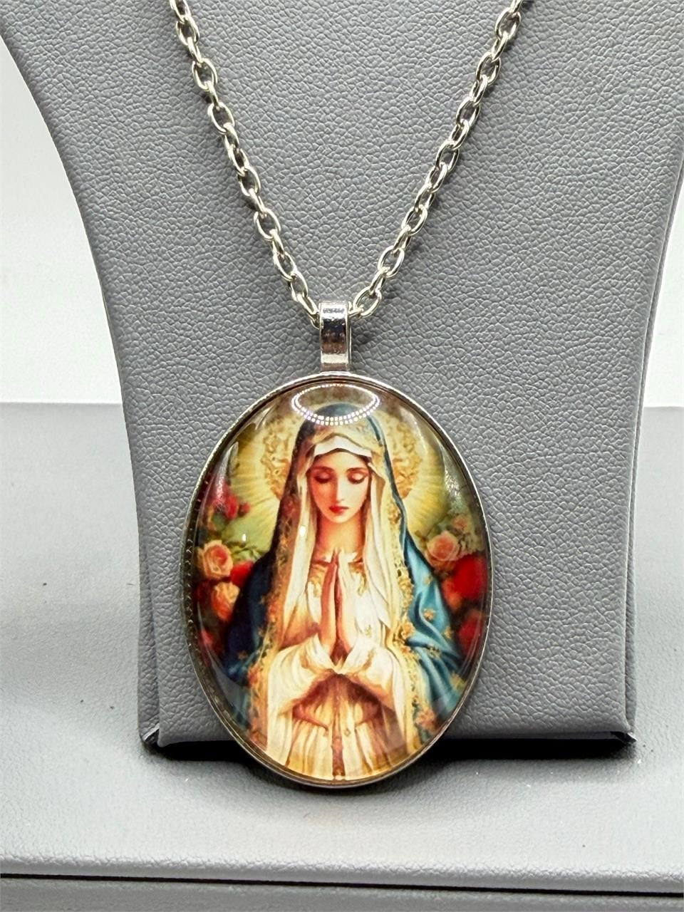 Virgin Mary enameled pendant necklace featuring a detailed religious icon on a silver chain, from Republic Mercantile.