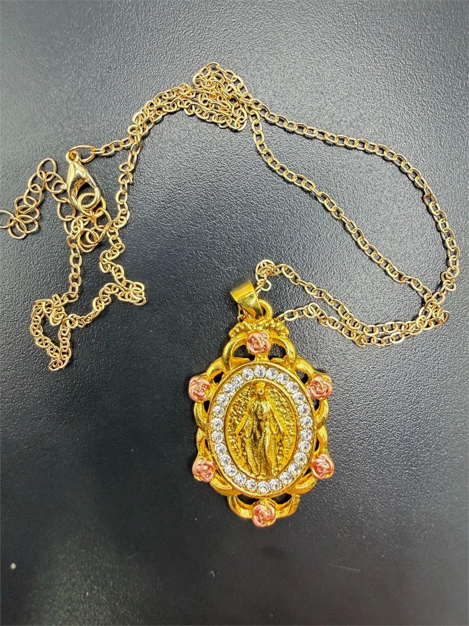 Gold tone Virgin Mary pendant necklace with bejeweled CZ accents, elegant religious jewelry by Republic Mercantile.