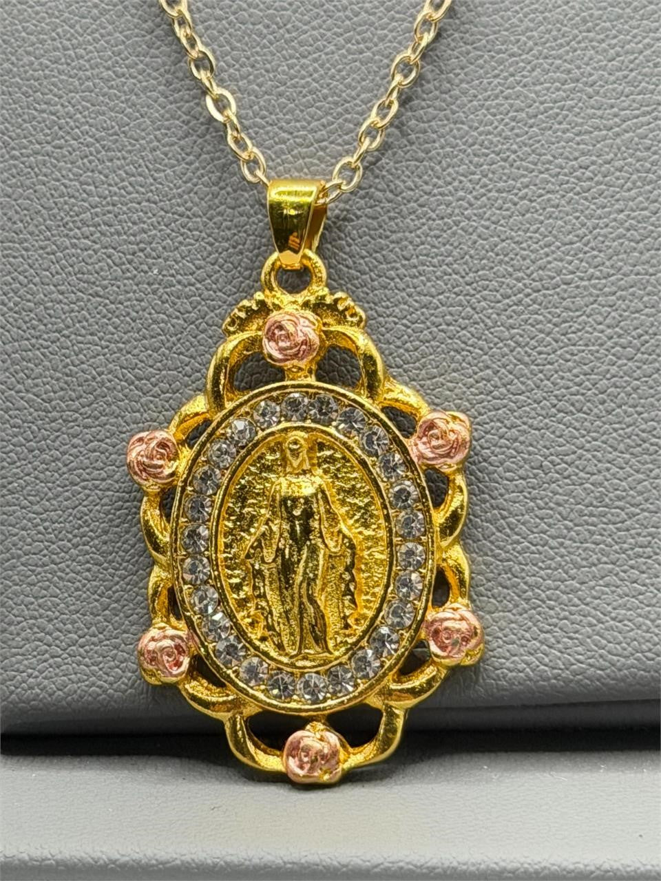 Virgin Mary bejeweled pendant necklace in gold tone with cubic zirconia, featuring intricate religious design, by Republic Mercantile.