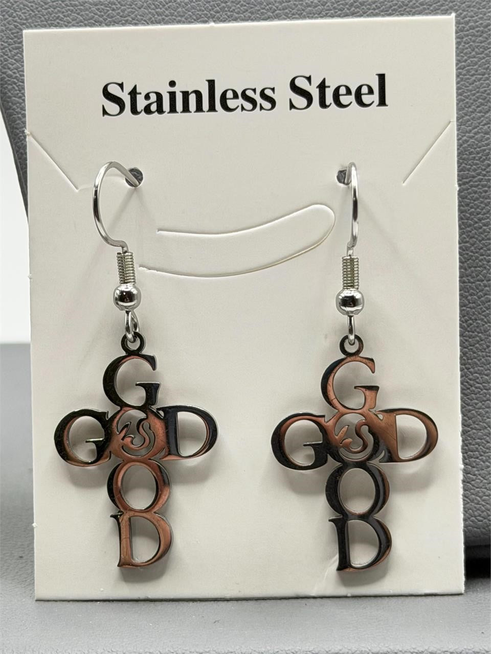 Christian-themed stainless steel earrings with "GOD" inscription, featuring a sleek, modern design for religious jewelry enthusiasts.