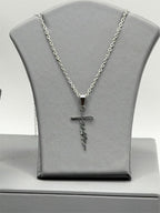 Christian-themed stainless steel necklace with faith pendant, featuring religious symbols on a sleek chain.