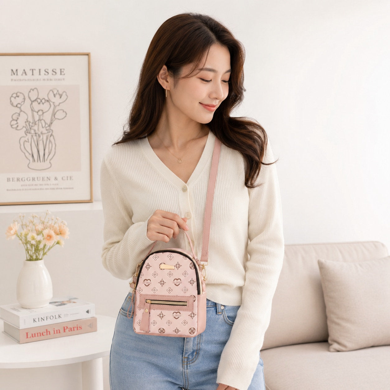 Pink Aohao heart-shaped faux leather crossbody backpack with zipper closure, stylish and compact for everyday use.