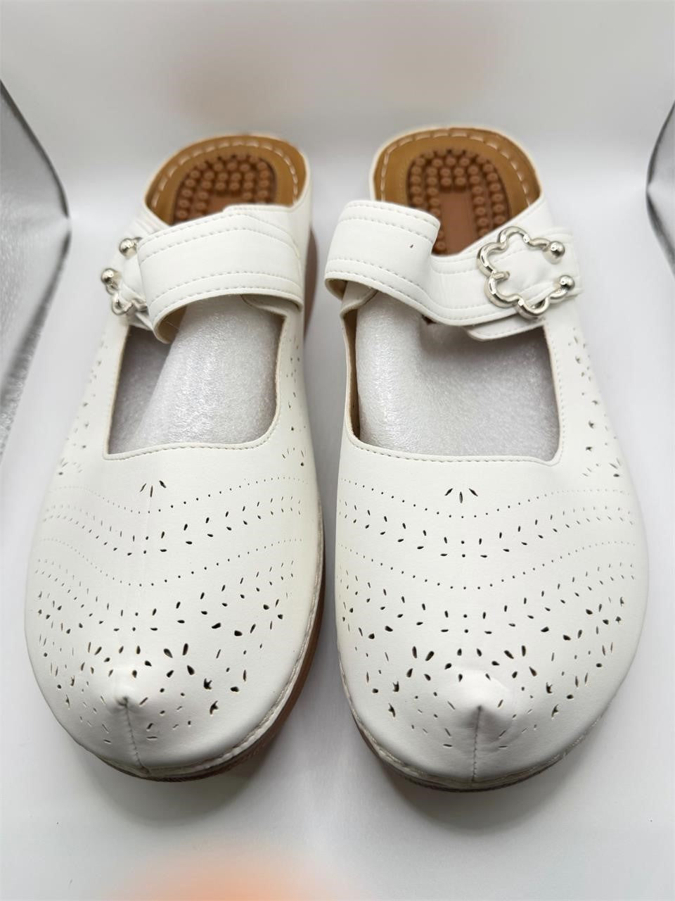 Women's white Ecetana wedge mules in size 10-10.5, featuring a stylish design with a comfortable wedge heel.