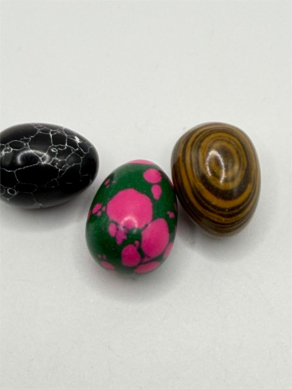 Polished oval gemstone cabochon collector set with three vibrant stones from Republic Mercantile, showcasing smooth, colorful gemstone surfaces.
