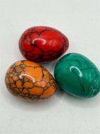 Three colorful polished stone cabochons from Republic Mercantile set, showcasing vibrant gemstone jewelry and smooth, rounded surfaces.