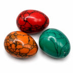 Three colorful polished stone cabochons from Republic Mercantile, showcasing vibrant gemstone colors and smooth, rounded surfaces.