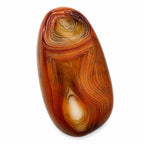 Polished banded agate loose gemstone cabochon from Republic Mercantile showing colorful natural banding and smooth polished surface.