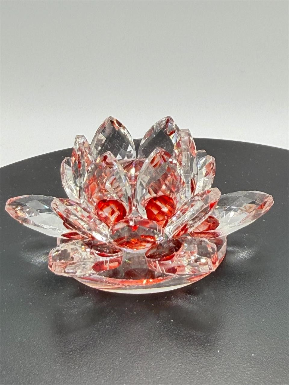 Red crystal lotus flower figurine by Republic Mercantile, showcasing intricate glass craftsmanship and floral design.