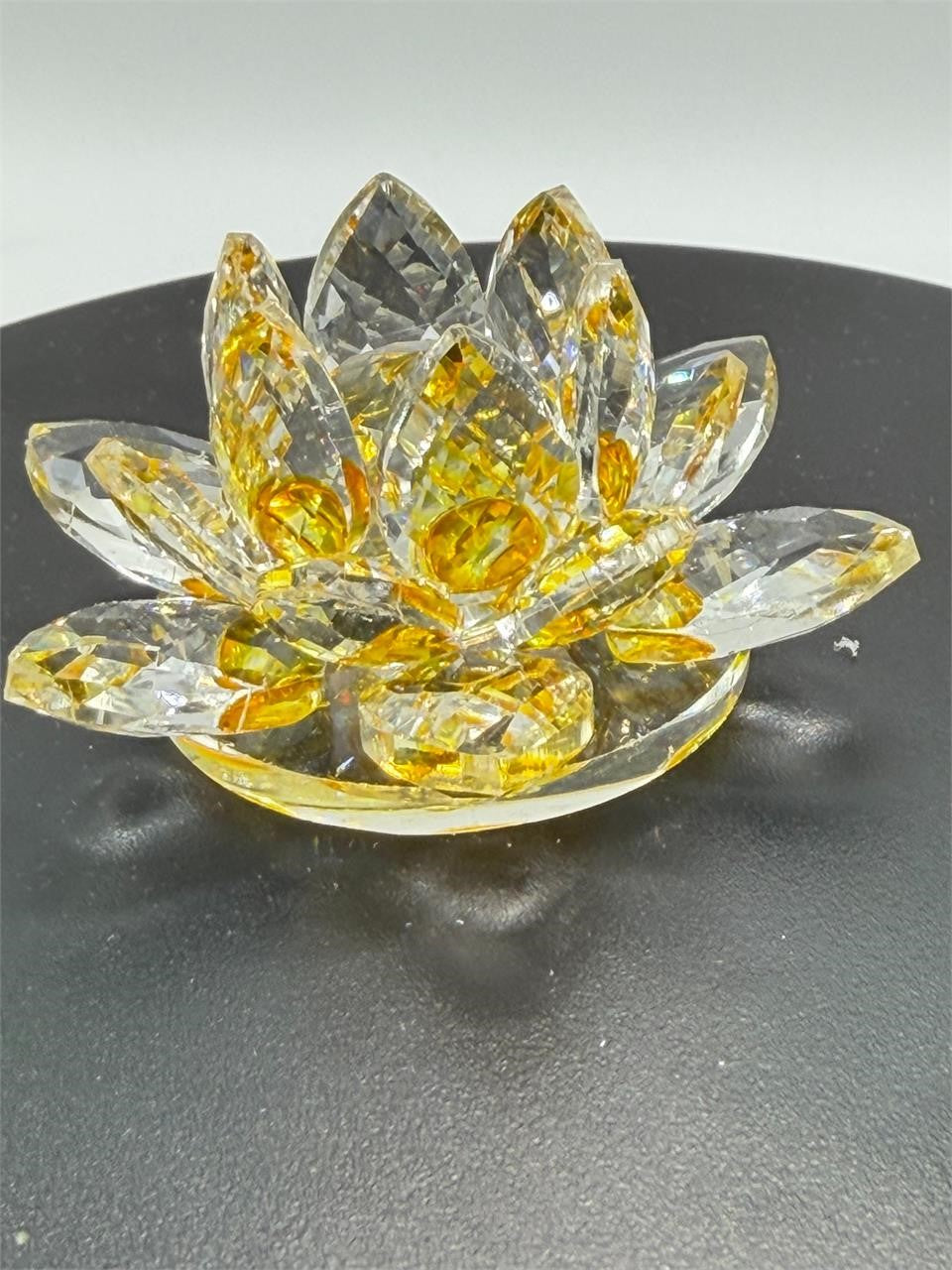 Yellow crystal lotus flower figurine by Republic Mercantile, featuring detailed craftsmanship and a delicate floral design.