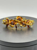 Ornate floral hair barrette with intricate metalwork and colorful floral accents, stylish accessory by Republic Mercantile.