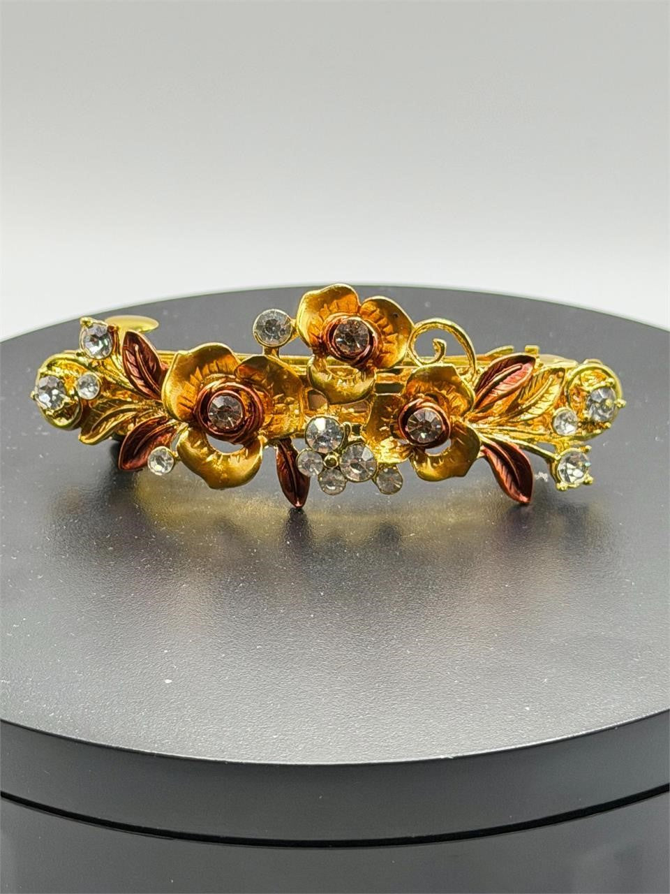 Ornate floral hair barrette with intricate metalwork and colorful floral accents, stylish accessory by Republic Mercantile.