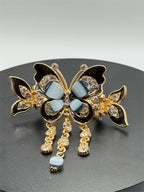 Black butterfly hair barrette with ornate details from Republic Mercantile, featuring intricate design and secure clasp.