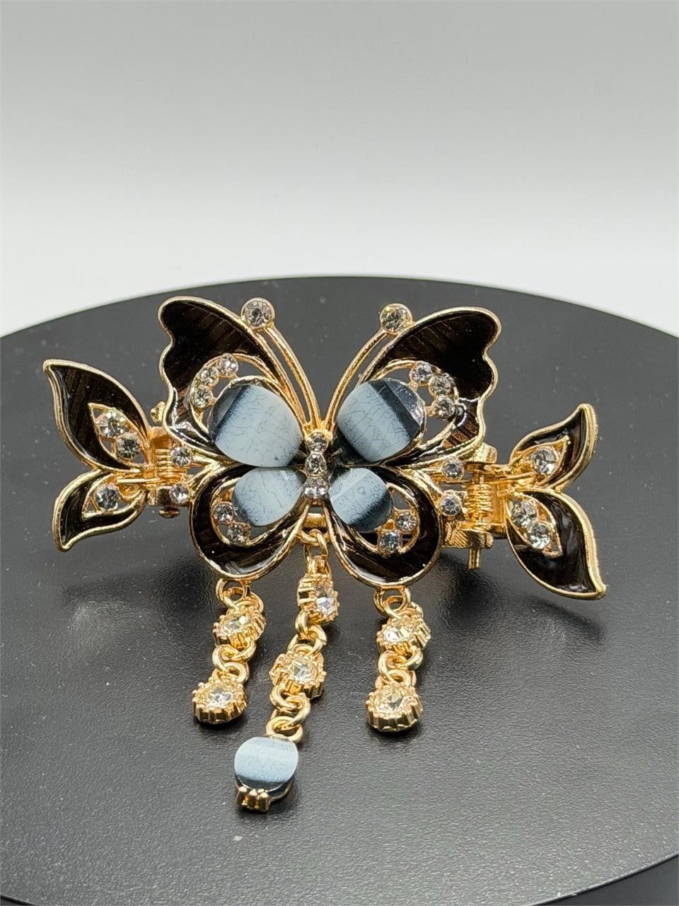 Black butterfly hair barrette with ornate details from Republic Mercantile, featuring intricate design and secure clasp.