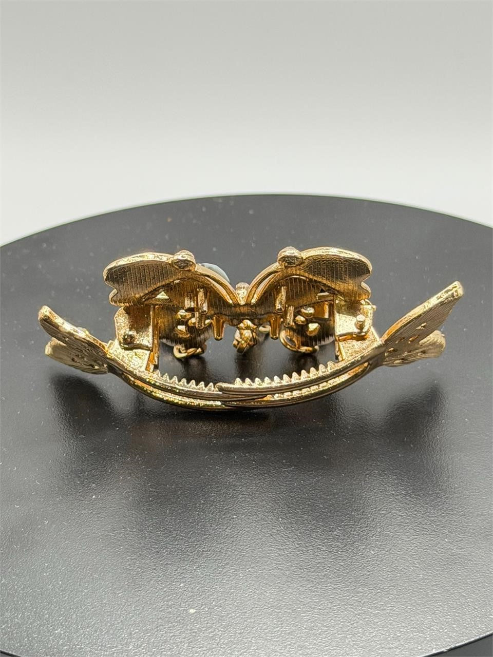 Black ornate butterfly hair barrette with intricate details, jewelry-inspired design, perfect for elegant hairstyles.