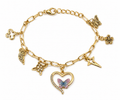 Handmade golden charm bracelet by Divine Designs featuring intricate charms on a delicate chain.