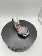 Men's Hkun black dial watch with silver case and band by Republic Mercantile, showing a close-up of the stylish timepiece.