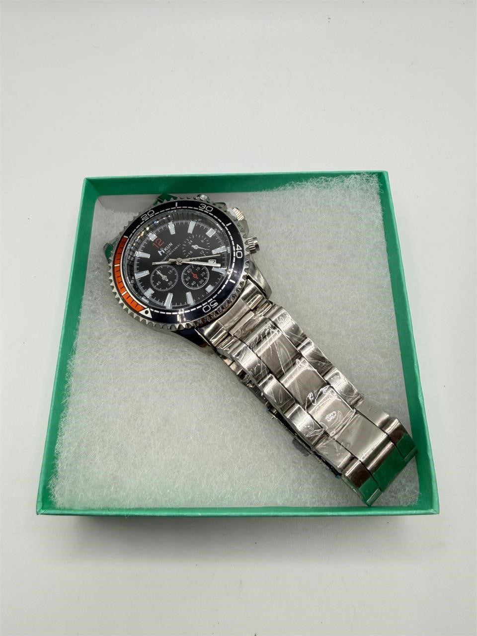 Men's black dial wristwatch with silver case and band from Republic Mercantile, showcasing a sleek and stylish timepiece.