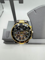 Men's black and gold Republic Mercantile Hkun watch with case and band, featuring a sleek design and detailed dial.