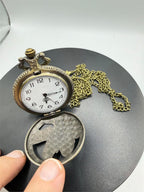 Silver man's pocket watch with chain featuring an eagle design, crafted by Republic Mercantile, displayed on a plain background.