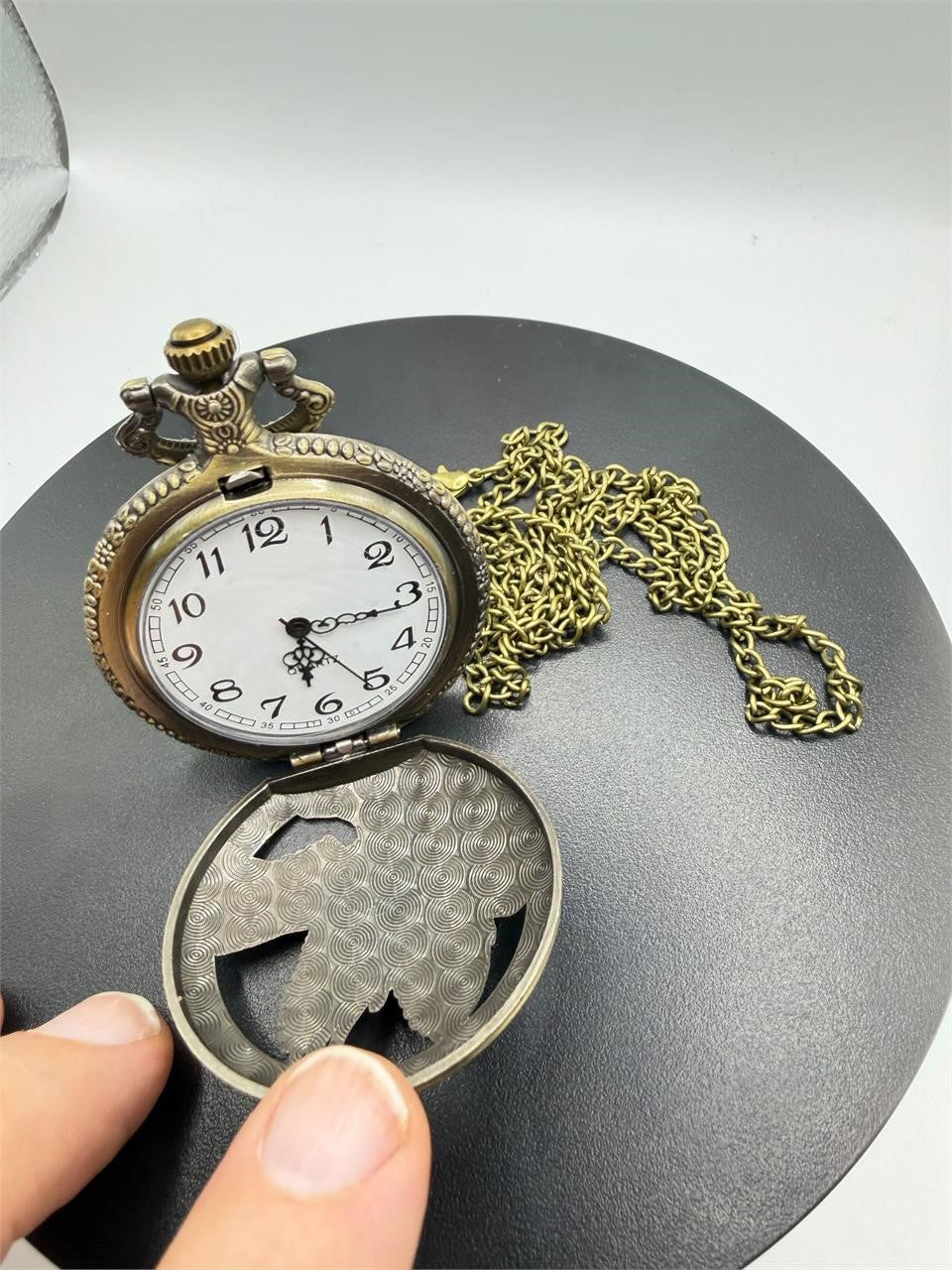 Silver man's pocket watch with chain featuring an eagle design, crafted by Republic Mercantile, displayed on a plain background.