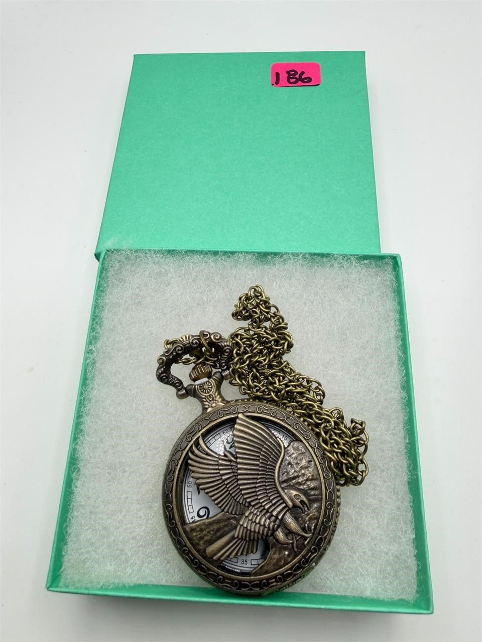 Silver man's pocket watch with chain featuring an eagle design, classic antique style by Republic Mercantile.
