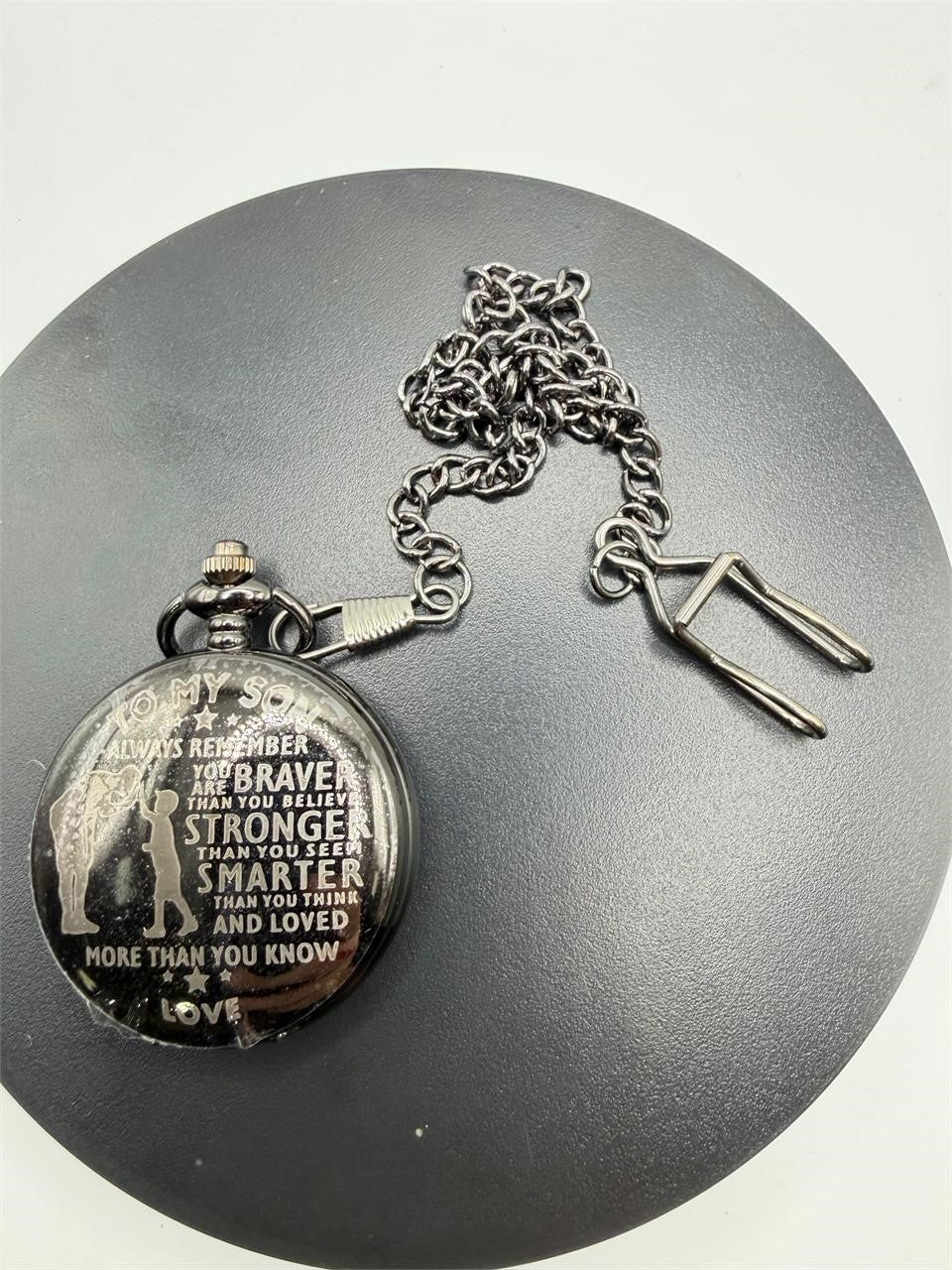 Silver man's pocket watch with chain, engraved "To My Son," from Republic Mercantile, displayed with open cover showing clock face.