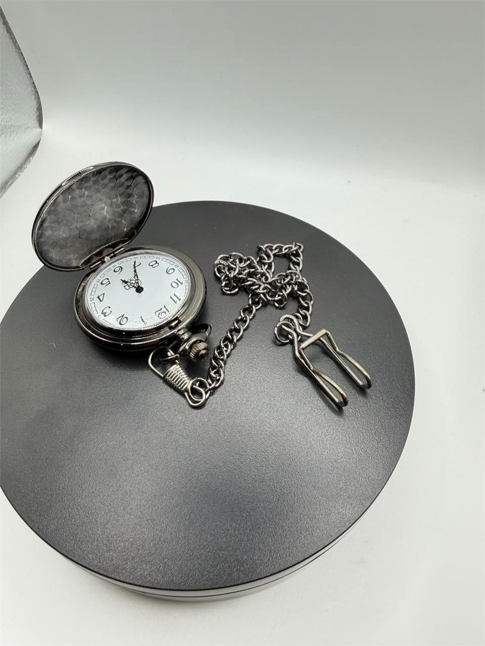 Silver pocket watch with chain, engraved with "To My Son," by Republic Mercantile, showing a classic vintage design.