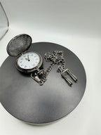 Silver pocket watch with chain, engraved with "To My Son," by Republic Mercantile, showing a classic vintage design.
