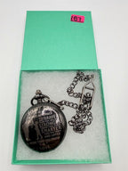 Silver man's pocket watch with chain from Republic Mercantile, engraved with "To My Son" on the cover.